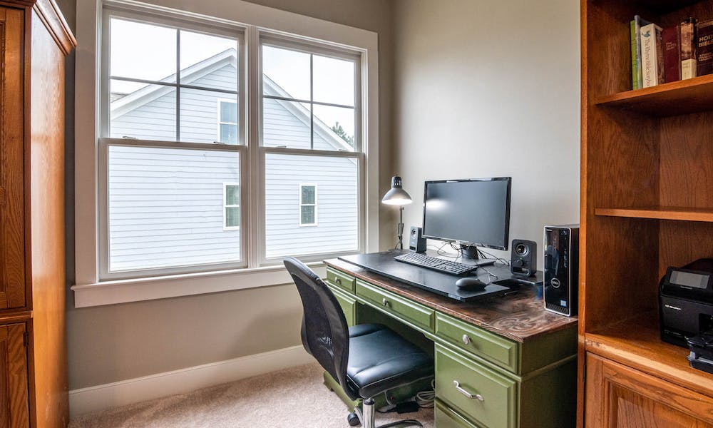room with mid back office chair