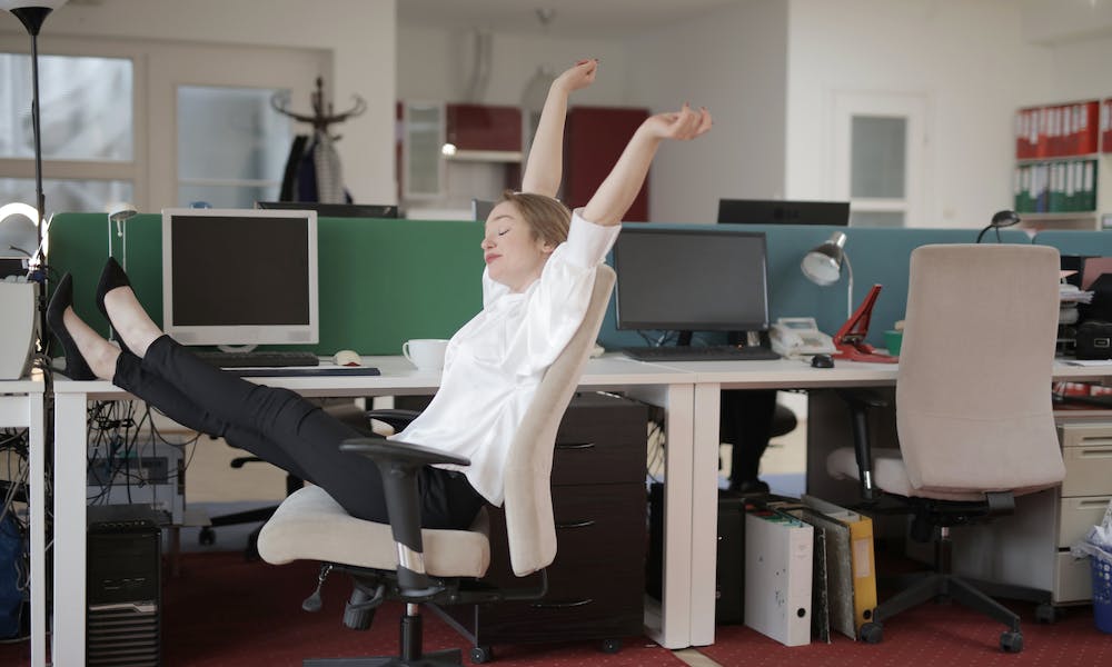 woman stretching in the office